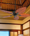 52 Inch Tropical Indoor Ceiling Fan With No Light And Pull Chain Three Mounting Options Hand Carved Wooden Leaf Blades In Bronze Finish Great For Medium To Large Rooms Up To 400 Sq Ft Big Room Breeze, shown installed in an elegant room.