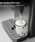Hella Smooth 20 Bar Automatic Espresso Machine Featuring Built In Grinder And One Touch Brew For Single Double Shots Or Americanos With Smart Alerts And No Fuss Maintenance, showcasing high-quality milk foam in glass.