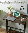 Mobile Standing Desk With Adjustable Height Rolling Desk Stand Up Station For Home Office Portable Laptop Desk On Wheels With Charging Station Rustic Brown indoors with laptop and tablet.