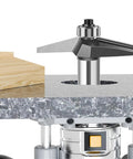 Heavy Duty Pro Grade 15 Degree Chamfer Router Bit For Woodworking Built Like A Tank mounted on a router table with wooden workpiece.