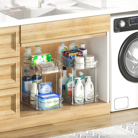 Slick Clear Under Sink Organizers And Storage Bins 2 Pack with cleaning supplies and toiletries stored in a kitchen cabinet.