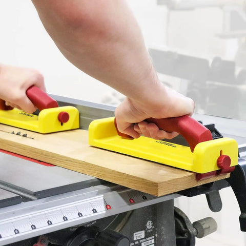 Hands using GrabberPLUS Pushblock For Table Saws Router Tables Band Saws And Jointers Yellow With Diamond Grip Rubber Bottom.