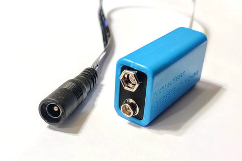 9V Battery Replacement Eliminator Kit For Smoke Detectors Fire Alarms Carbon Monoxide Detectors Bedside Radios Multimeters And Other Electronics No Fuss Plug And Play Power Solution With A 120V AC Wall Adapter And An Active Dummy Cell, showing blue dummy cell and connector.