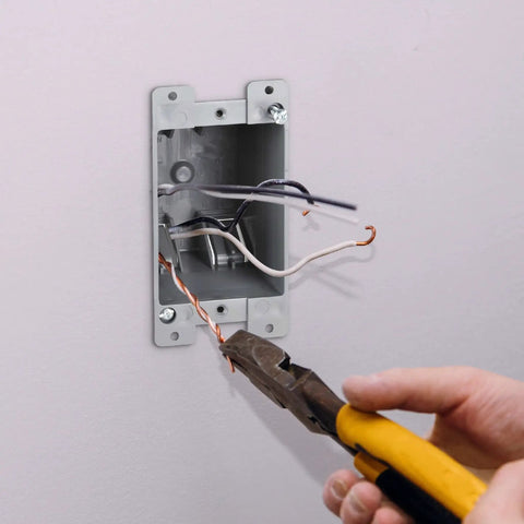 One Gang PVC Old Work Electrical Box 12 Pack 14 Cu In Plastic Junction Box being installed with pliers