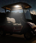 Hella Bright Universal Golf Cart Dome Light With Usb Rechargeable Battery And Cool White Led For Smooth Wireless Roof Lighting Plus Quick Touch Settings On Any Standard Model illuminates a parked golf cart at night.