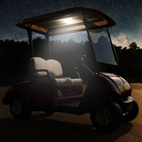 Hella Bright Universal Golf Cart Dome Light With Usb Rechargeable Battery And Cool White Led For Smooth Wireless Roof Lighting Plus Quick Touch Settings On Any Standard Model illuminates a parked golf cart at night.