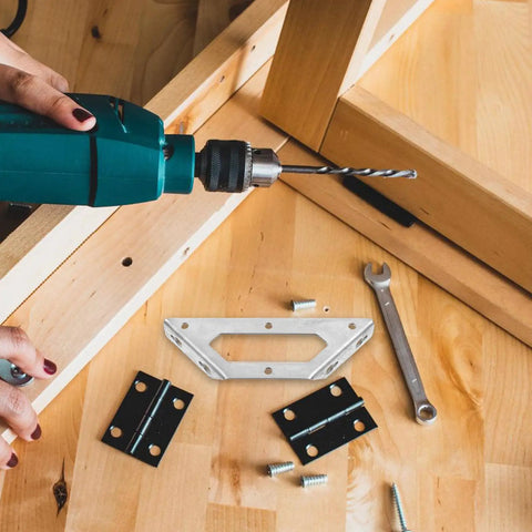 Drill and tools with Stainless Steel Angle Brackets For Beams And Shelves, Heavy Duty Corner Braces on wooden surface
