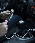 Wizard Pro V3 XHP50 Warm USB Magnetic Headlamp With 2300 Lumens Beast Brightness being charged in car with magnetic USB cable