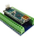 Rock Solid Screw Terminal Block Shield For Arduino Nano That Delivers Tight Secure Wiring With Easy Clamp Terminals And Durable Design For Any Nano Project Prototyping Or Embedded Applications, green terminals, blue board