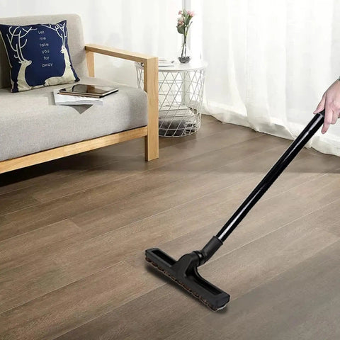 Person using Vacuum Extension Wand Set One And A Quarter Inch 32mm Tubes Fourteen Point Seven Inch Long Three Piece Kit cleaning wooden floor