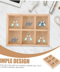 Six Compartment Wood Jewelry Tray With Multi Grid Layout For Rings And Bracelets Rustic Countertop Trinket Dish displaying blue earrings.