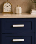 Blue cabinet with 4 Pack Gold Cabinet Pulls With Pearl Inlay And Brushed Brass Base, Solid Zinc Alloy Drawer Handles