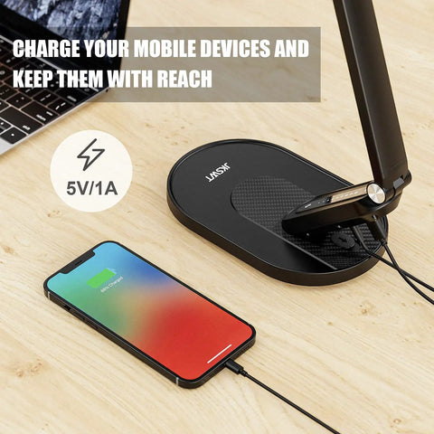 LED Desk Lamp With Eye Caring Light 72 LEDs 9 Brightness Levels 5 Color Modes USB Charging Touch Control And Memory 10W Reading Light For Your Home Office Black with a phone charging on the USB base.