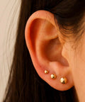 Extra Long Post Earrings Set, 5 Pairs 316L Stainless Steel Ball Studs For Women And Men, Hypoallergenic And Nickel Free, 2-6mm, Lead Free, Waterproof All Day Comfort For Sensitive Ears, Steel Color. Gold ball studs worn in ear lobe