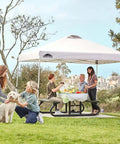 10x10 Foot Pop Up Canopy Tent With Wheeled Carry Bag, Easy One Person Setup, white tent over picnic table, family gathering outdoors