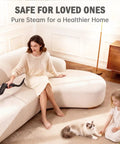 High Performance 1600W Port Steam Cleaner With 1.69 QT Visible Tank used on sofa for deep cleaning upholstery.
