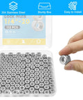 Top Shelf 112 Pack 1/4 20 Hex Lock Nuts Cut From Pure 304 Stainless Steel Featuring Nylon Inserts For Killer Anti Vibration Grip On Every Home Shop Build in a storage box with a hand holding one nut.