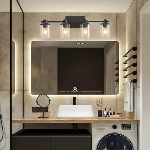 4 Light Modern Vanity Light With Industrial Matte Black Finish And Clear Glass Shades over a bathroom mirror