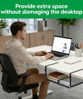 Man working at desk with Under Desk Organizer With Heavy Duty C Clamp, Adjustable Height Keyboard And Mouse Shelf, Space Saving Desk Storage Rack, Carbon Steel Black, visible.