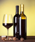 Wine Sealer Kit With Cork Stoppers And PVC Heat Shrink Capsules for resealing open bottles next to two wine bottles and a glass.