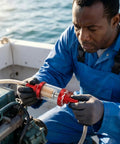 Person installing Five Sixteenth Inch Beefy Inline Gas Filter With Reusable Aluminum Body And Clear Glass For Small Engines.