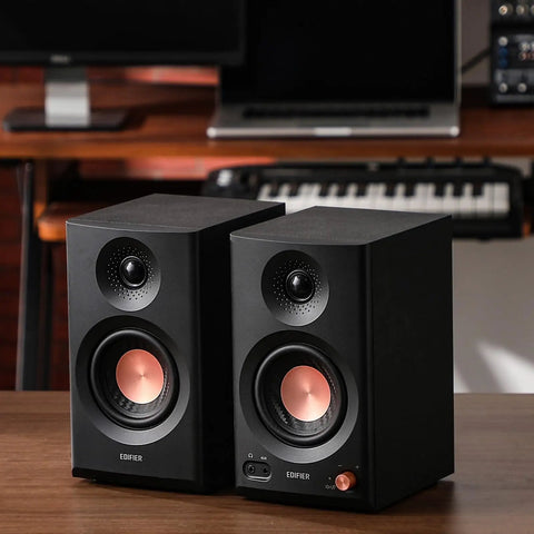 MR3 Powered Studio Monitors With Hi-Res Audio Certification And Bluetooth 5.4 on a wooden desk in a studio setup