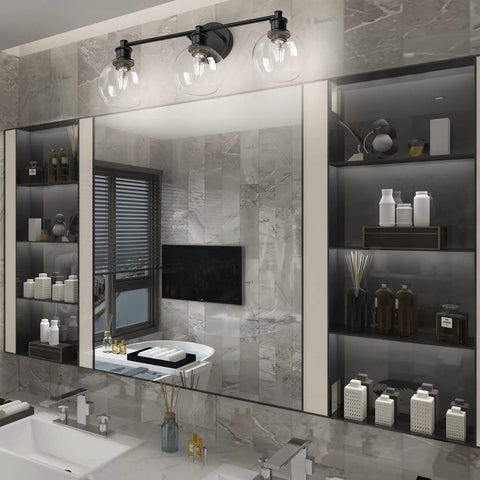 Three Light Industrial Vanity Fixture In Matte Black With Clear Glass Globes in a modern bathroom setting