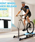 Cyclist using Detachable Indoor Bike Resistance Trainer With Quick Release Front Wheel No-Slip Balance Rack in home gym