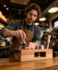 Upgrade Your Home Cafe Setup With This Durable Natural Wood Espresso Tamper Station housing a 58mm tamper and dosing tools.