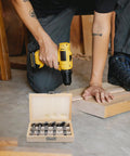 Knockout 5 Piece Forstner Bit Set For Woodworking That Booms With Precision, multiple teeth in wooden case during drilling.