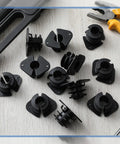 Top view of Briwooody 50-pack 3/4 in pipe isolation clamps, black plastic supports for PEX, copper and CPVC pipes.