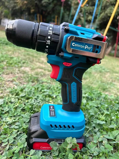 Boss Level 21V Cordless Drill Set With Dual Speed Mode, 10mm Quick Change Chuck, 2 Batteries, And 24 Piece Accessory Kit on grass.