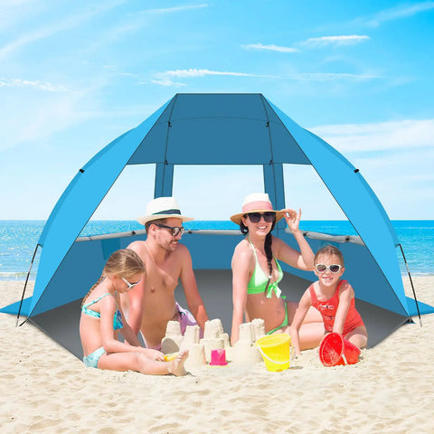 Family enjoying sandcastle under Portable Beach Tent For 3 To 7 People, UPF 50 Plus Sun Shelter, on a sunny beach day