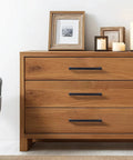 Matte Black Cabinet Handles Set Of 10, 5 Inch Center To Center, on wooden dresser in bedroom setting
