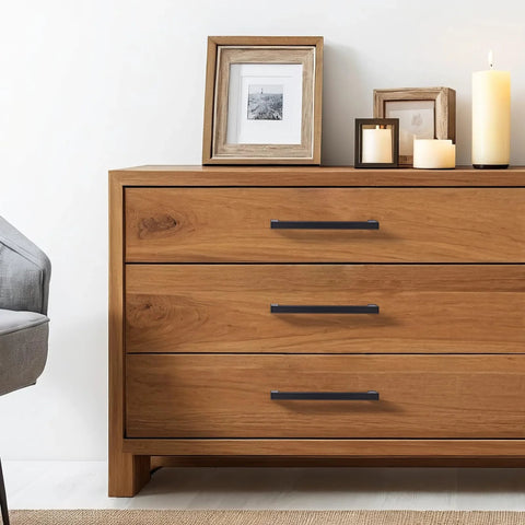 Matte Black Cabinet Handles Set Of 10, 5 Inch Center To Center, on wooden dresser in bedroom setting