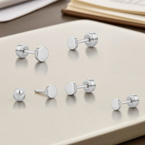 Implant Grade F136 Titanium Dot Stud Earrings Featuring Secure Screw Back Flat Posts, silver studs on a light background.