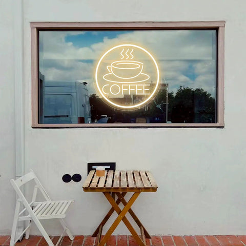 Coffee Cup Neon Sign USB Powered LED Light With 3D Engraved Art displayed on an outdoor window of a cafe.