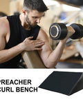 Man lifting dumbbell using Ergonomic Black Curl Pad For Home Gym Space Saving Bicep Support With Adjustable Foam Comfort