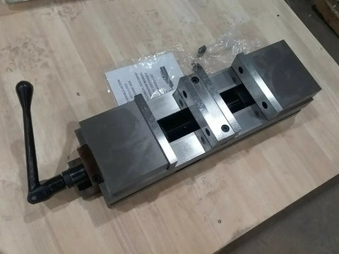 Six Inch Double Lock Cnc Machine Vise With Hardened Steel Bed And Reversible Step Jaws For Heavy Duty Fabrication, top view showing locking handle.