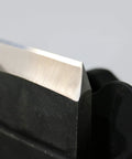 Close-up of blade in Honing Guide Sharpening Jig For Chisels And Planes Blades Japanese Woodworking Tool Guide With Pro Grade Angle Control