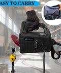 Person holding All In One Beefed Up Electric Hoist Winch 1100 Lb Portable with double hooks in factory setting