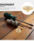 Top Tier Perseleso 2g Headshell Counterweight on wooden surface with screwdriver, ideal for precise tonearm tuning.