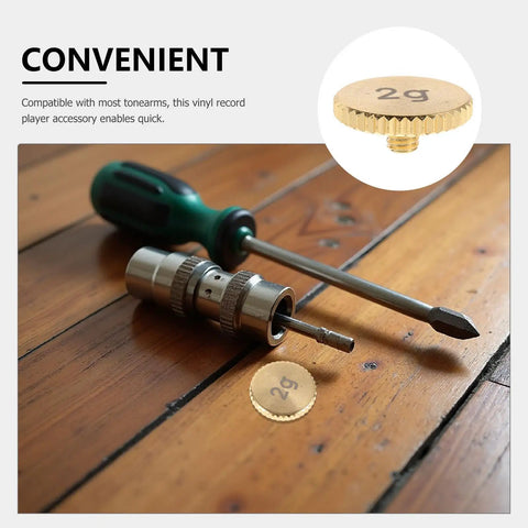 Top Tier Perseleso 2g Headshell Counterweight on wooden surface with screwdriver, ideal for precise tonearm tuning.