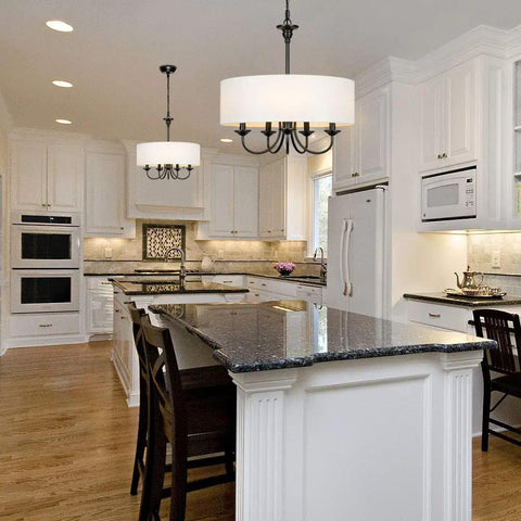 Traditional 5 Light Chrome Drum Chandelier With White Linen Shade For Dining Room shown above a modern kitchen island.