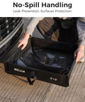 Person setting up Spill Containment Berm Folding Duck Pond for Oil Changes and Under Drip Protection, Portable Secondary Containment Tray.