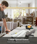 Industrial 5 Outlet Power Hub With 15 Ft Heavy Duty Extension Cord For Garage And Workshop in a workshop setting.