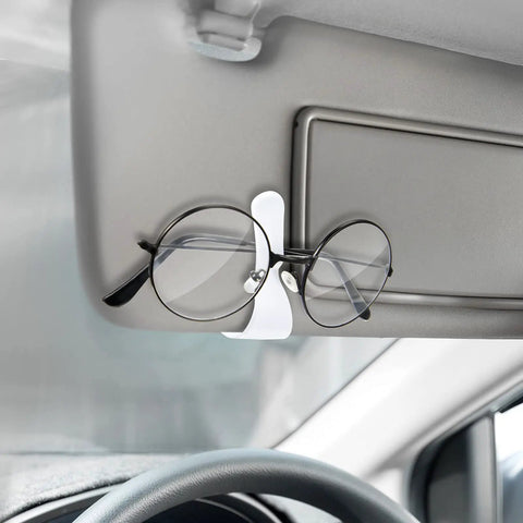 White clip from 12 Pack Car Visor Clips For Sunglasses Holder And More Multipurpose Vehicle Visor Accessories holding glasses