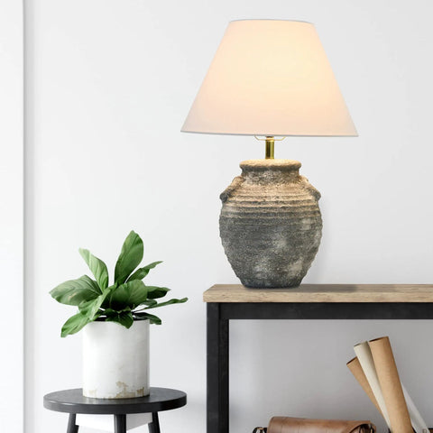 Grey Terracotta Table Lamp With Distressed Sculptural Base And Linen Shade, 23 Inch Tall, Iron Accents on a side table