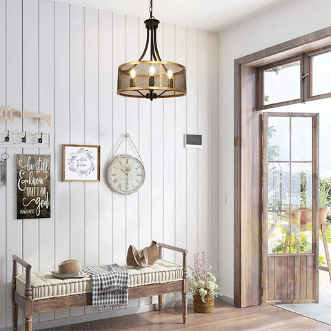Five-light metal pendant lantern in a rustic farmhouse entryway with natural light, wood accents, and decor.