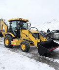 4WD Compact Backhoe Loader With 2.2m Digging Depth And Multi Attachments in snowy construction site, ready for work